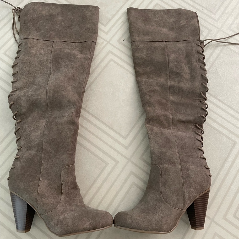 Knee high boots. Tried on, but never worn. Size 6.5